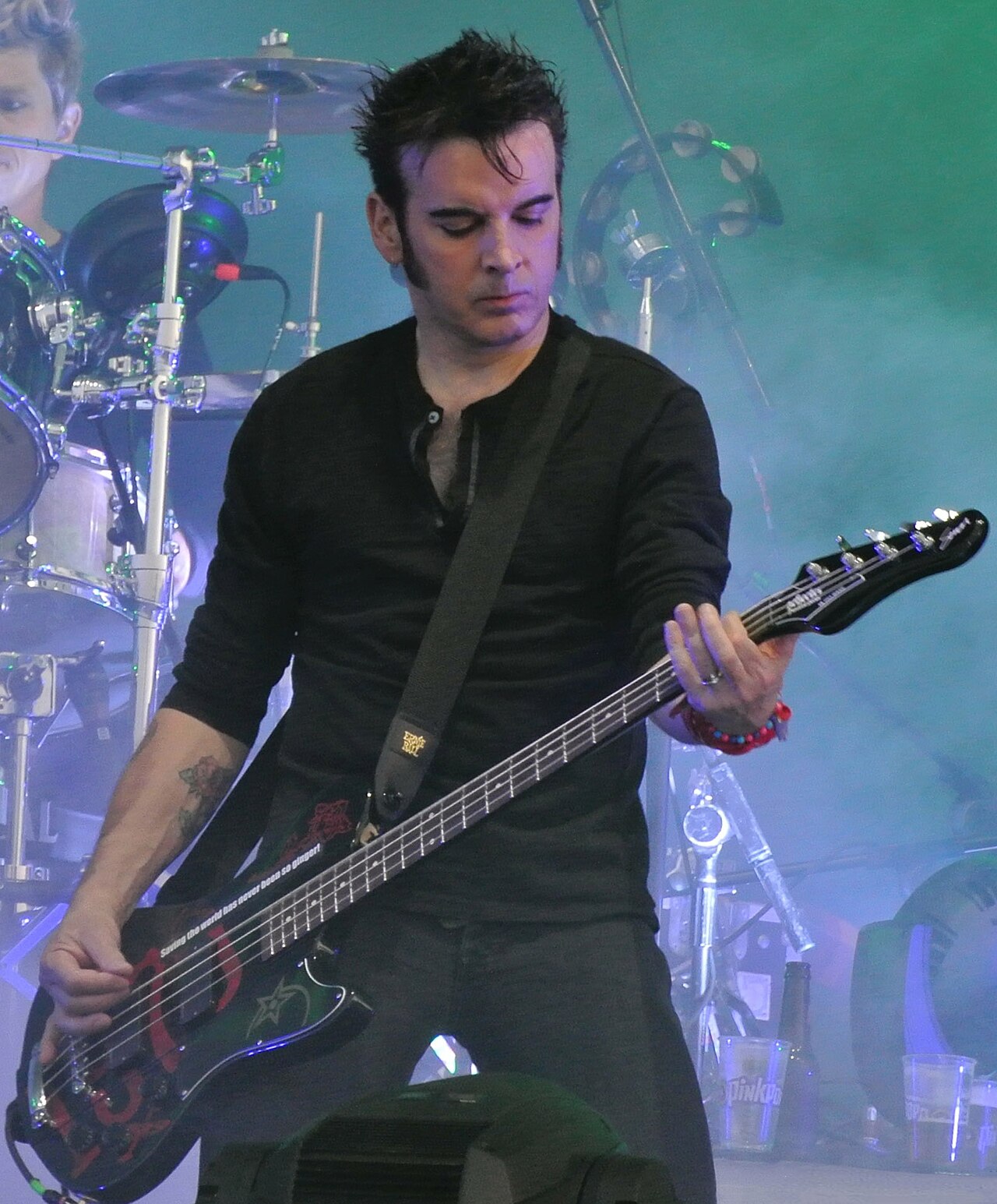 Simon Gallup and Jason Cooper from The Cure in 2012 (cropped)