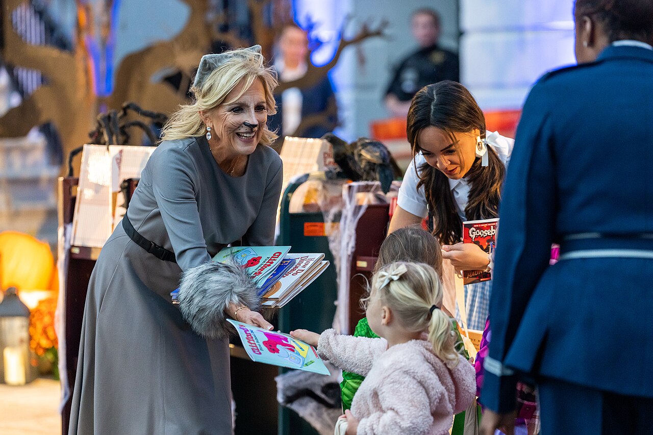 President Joe Biden and First Lady Jill Biden hand out candy and books to trick-or-treaters at the South Portico for Halloween.jpg