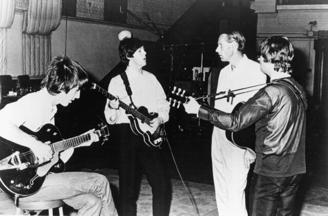 The Beatles with George Martin in the studio, 1966.